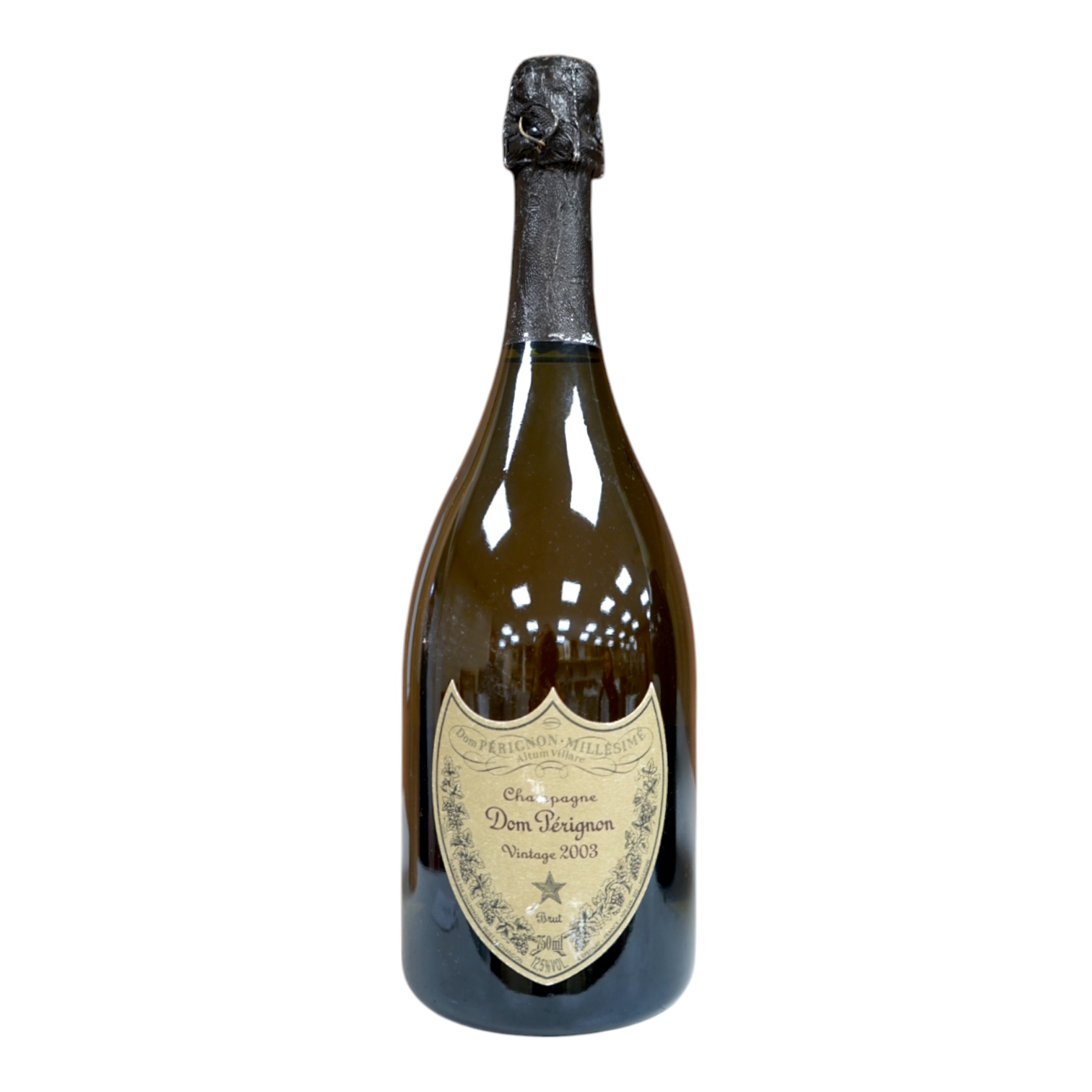 A 2003 vintage bottle of Dom Perignon champagne. Condition - fair to good, minor label wear, etc.